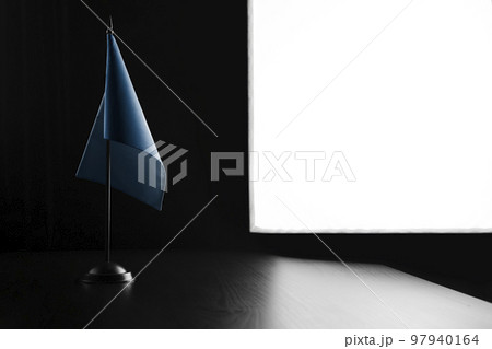 Small national flag of the Food and agriculture organization on a black background 97940164
