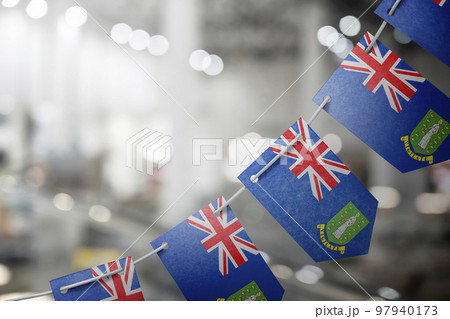 A garland of British Virgin Islands national flags on an abstract blurred background 97940173