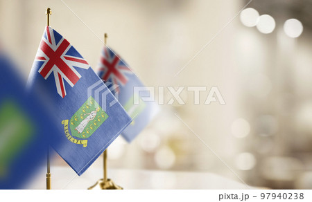Small flags of the British Virgin Islands on an abstract blurry background Small flags of the British Virgin Islands on an abstract blurry background 97940238