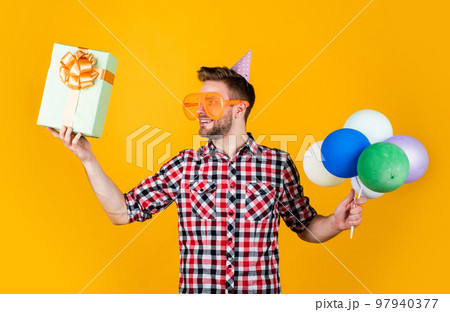 Shopping day. fathers day concept. handsome cheerful young man with smile having fun on party. people and joy. birthday and celebration concept. real happiness. crazy party man on happy holiday 97940377