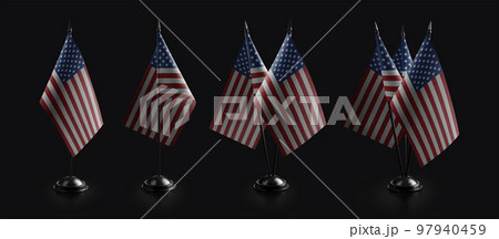 Small national flags of the USA on a black background Small national flags of the USA on a black background 97940459