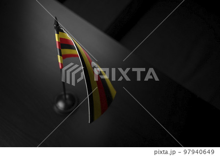 Small national flag of the Uganda on a black background 97940649