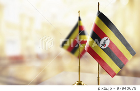 Small flags of the Uganda on an abstract blurry background Small flags of the Uganda on an abstract blurry background 97940679