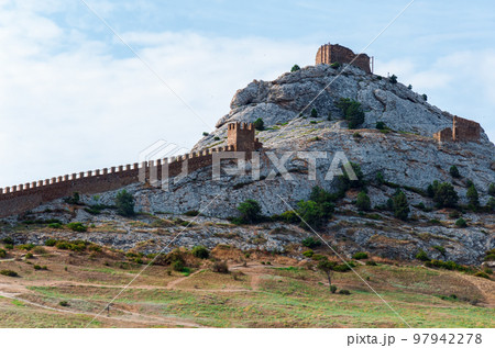 Ancient Genoese fortress on a mountain in the city of Sudak, Crimea 2021 August. Ancient Genoese fortress on a mountain in the city of Sudak, Crimea 2021 August. 97942278