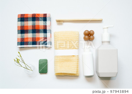 Bathroom spa products. shampoo, shower soap, towel, toothbrush on white background. flat lay, top view, copy space 97943894