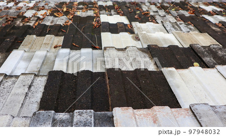 Texture of dark colour traditional double carved roof tiles Texture of dark colour traditional double carved roof tiles 97948032