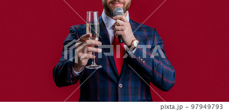 presenter cheering and hold microphone isolated on red background. presenter celebrate event presenter cheering and hold microphone isolated on red background. presenter celebrate event 97949793