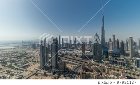 Panorama showing aerial view of tallest towers in Dubai Downtown skyline and highway timelapse. Panorama showing aerial view of tallest towers in Dubai Downtown skyline and highway timelapse. 97951127