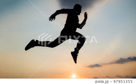 Freedom is not enough. personal achievement goal. man silhouette jump on sky background. confident businessman running. daily motivation. enjoying life and nature. business success. freedom Freedom is not enough. personal achievement goal. man silhouette jump on sky background. confident businessman running. daily motivation. enjoying life and nature. business success. freedom 97951355