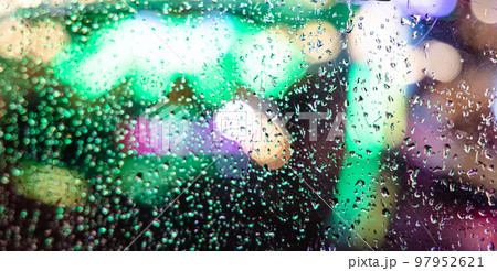 Water droplets on glass window 97952621
