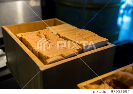 Assortment of fresh bread on table in buffet. Sliced white bread 97952694