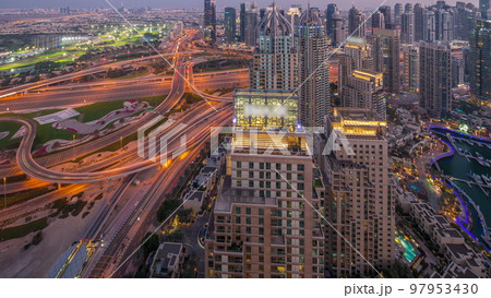 Dubai marina and JLT skyscrapers along Sheikh Zayed Road aerial day to night timelapse. Dubai marina and JLT skyscrapers along Sheikh Zayed Road aerial day to night timelapse. 97953430
