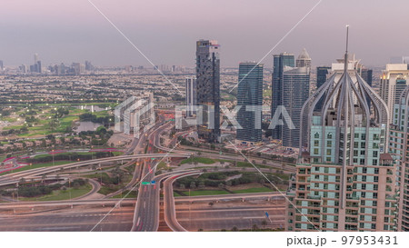 Huge highway crossroad junction between JLT district and Dubai Marina aerial day to night timelapse. Huge highway crossroad junction between JLT district and Dubai Marina aerial day to night timelapse. 97953431