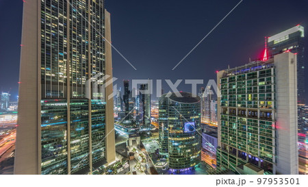 Dubai international financial center skyscrapers aerial all night timelapse. 97953501