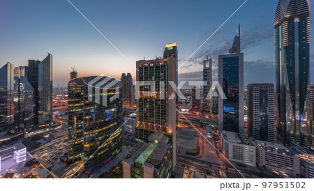 Dubai international financial center skyscrapers aerial day to night timelapse. 97953502