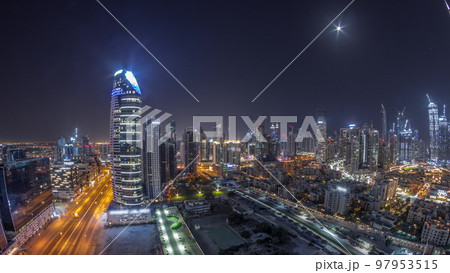 Dubai's business bay towers aerial all night timelapse. Rooftop view of some skyscrapers 97953515