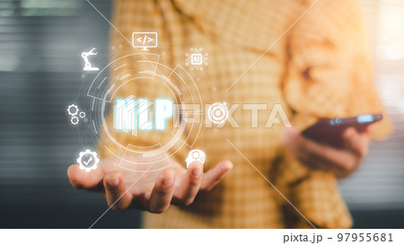 NLP natural language processing cognitive computing technology concept, Business person hand holding VR screen NLP icon on office desk, AI Artificial intelligence. 97955681