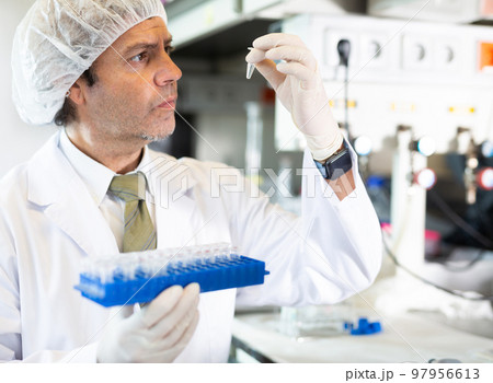 Confident man technician working in research laboratory 97956613