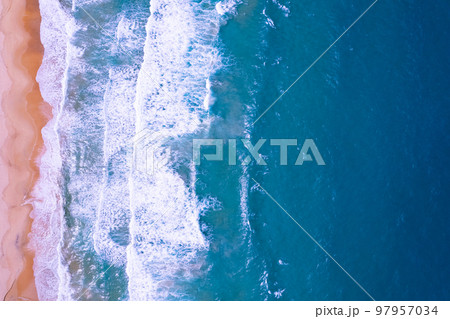 Aerial view of beach sea and waves crashing on sand beach in summer season, Amazing sea beach with ocean wave foams Beautiful top view of beautiful sea surface, Concept holiday summer background Aerial view of beach sea and waves crashing on sand beach in summer season, Amazing sea beach with ocean wave foams Beautiful top view of beautiful sea surface, Concept holiday summer background 97957034