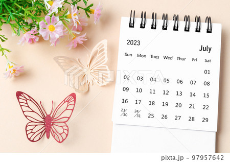 A July 2023 desk calendar for the organizer to plan, reminder on yellow background. 97957642