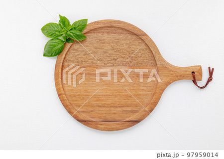 Pizza dough in wooden pizza platter set up on white wooden . Pizza tray on white wooden background flat lay and copy space. 97959014