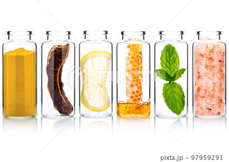 The glass bottle of homemade skin care and body scrubs with natural ingredients aloe vera ,himalayan salt ,peppermint ,rosemary ,turmeric and honey isolate on white background. 97959291