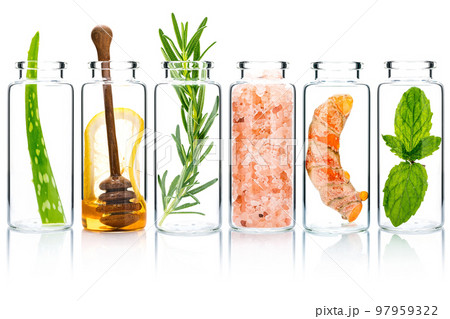 The glass bottle of homemade skin care and body scrubs with natural ingredients aloe vera ,himalayan salt ,peppermint ,rosemary ,turmeric and honey isolate on white background. The glass bottle of homemade skin care and body scrubs with natural ingredients aloe vera ,himalayan salt ,peppermint ,rosemary ,turmeric and honey isolate on white background. 97959322
