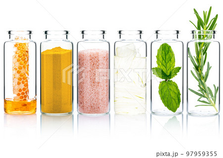 The glass bottle of homemade skin care and body scrubs with natural ingredients aloe vera ,himalayan salt ,peppermint ,rosemary ,turmeric and honey isolate on white background. 97959355