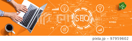 SEO concept with person using a laptop 97959602