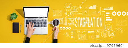 Stagflation theme with person using laptop computer Stagflation theme with person using laptop computer 97959604