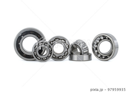 Group of various ball and roller bearings on white Group of various ball and roller bearings on white 97959935