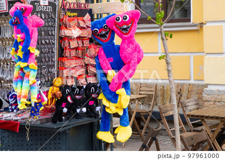 blue Huggy Wuggy and pink Kissy Missy toys at street market. 97961000