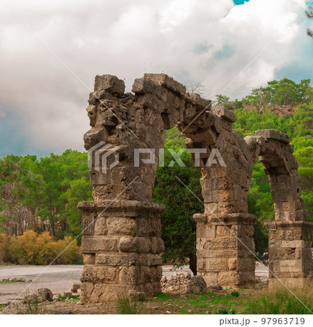 Ruins of aquaeduct in ancient city Phaselis, Antalya Province, Turkey. Lycian ancient civilization heritage. 97963719