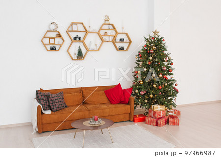 Scandinavian living room interior with christmas decorations and gifts in red paper 97966987