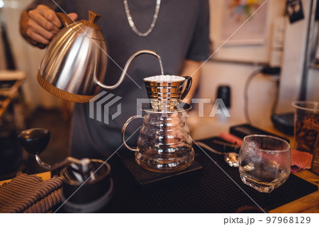 Close up of hand brewing coffee 97968129