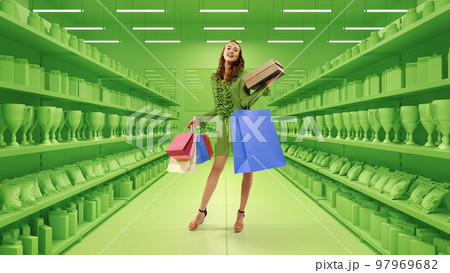 Portrait of young stylish woman standing with many shopping bags oevr 3D model of supermarket background. Big sales season, Black Friday concept 97969682