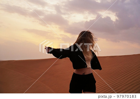 Young woman in the desert. The concept of happiness, freedom, travel 97970183