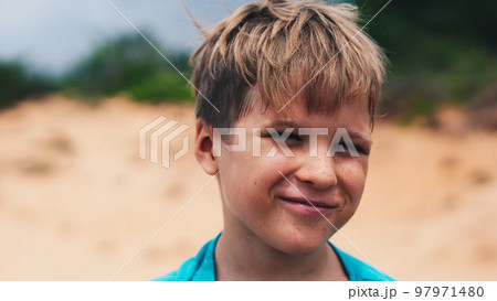 Close up portrait Boy blond freckles smile fun cunning facial expression wrinkle bright sun charming nature Close up portrait Boy blond freckles smile fun cunning facial expression wrinkle bright sun charming nature 97971480