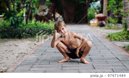 Boy blond freckles squatting sit smiling show gesture thumbs up shirtless bare chested shorts nature Boy blond freckles squatting sit smiling show gesture thumbs up shirtless bare chested shorts nature 97971484