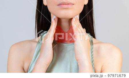 Sore throat in flu season. Young asian woman touching her neck and feeling pain in throat in the bedroom at home. Sore throat in flu season. Young asian woman touching her neck and feeling pain in throat in the bedroom at home. 97971679