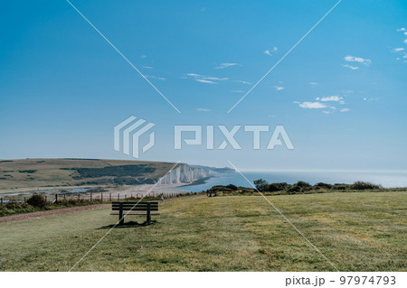 The Coast Guard Cottages and Seven Sisters Chalk Cliffs just outside Eastbourne, Sussex, England, UK. The Coast Guard Cottages and Seven Sisters Chalk Cliffs just outside Eastbourne, Sussex, England, UK. 97974793