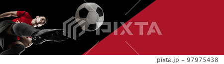 Bottom view on man, professional soccer, football player training, hitting ball over black red background. Banner Bottom view on man, professional soccer, football player training, hitting ball over black red background. Banner 97975438
