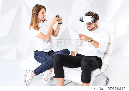 Couple having fun playing with virtual reality 97976845