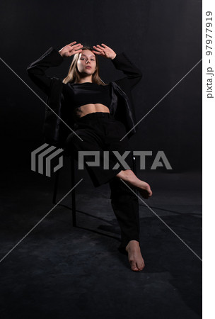 female ballet attractive girl brunette young person black sitting caucasian beautiful chair woman 97977919
