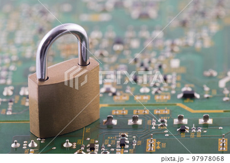 Computer security concept. Padlock on green computer circuit board Computer security concept. Padlock on green computer circuit board 97978068