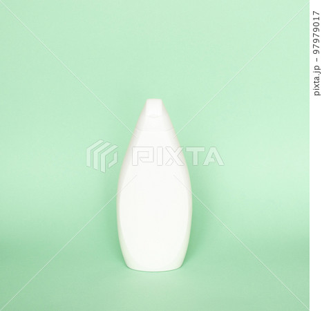 Blank shampoo bottle or shower gel on pastel green background. Container, beauty product and body care cosmetics. 97979017