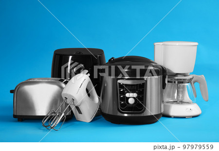 Set of different household appliances on light blue background 97979559
