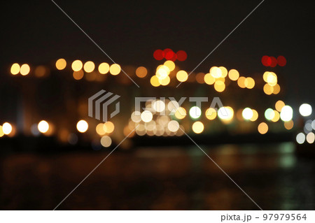 Blurred view of docks at night. Bokeh effect Blurred view of docks at night. Bokeh effect 97979564
