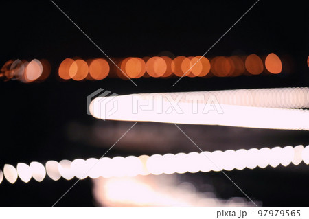 Blurred view of night city. Bokeh effect Blurred view of night city. Bokeh effect 97979565