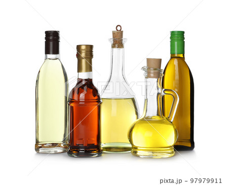 Different sorts of cooking oil in bottles isolated on white Different sorts of cooking oil in bottles isolated on white 97979911